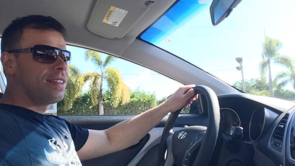 Local Miami insider driving responsibly to emphasize safe driving and avoid rental car accidents.