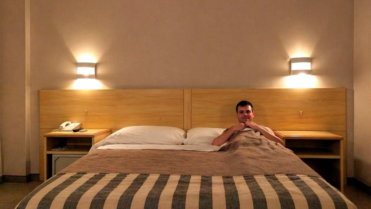 A smart traveler enjoying a high-value Miami hotel stay without hidden resort fees or parking traps.